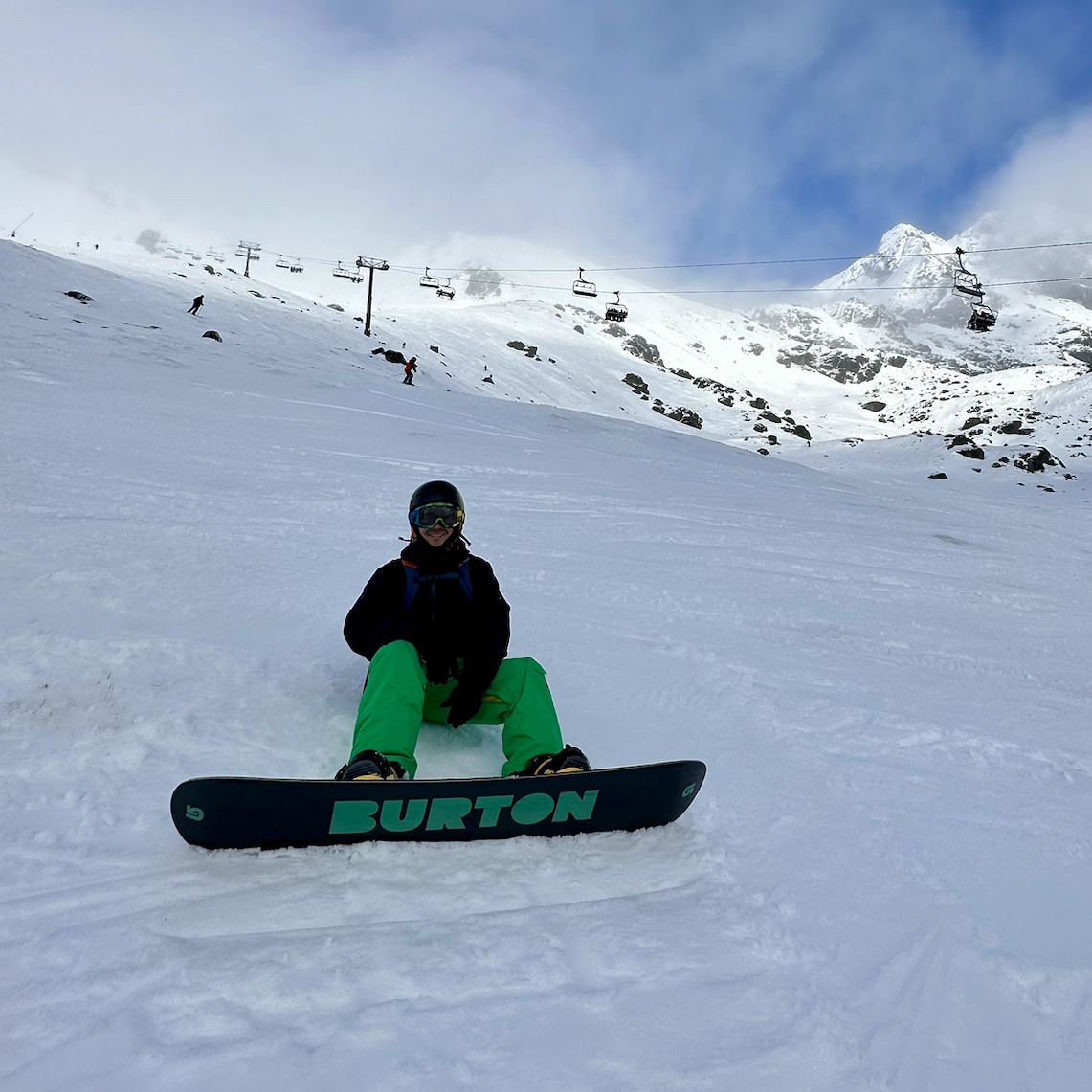 Victor snowboarding in New Zealand.