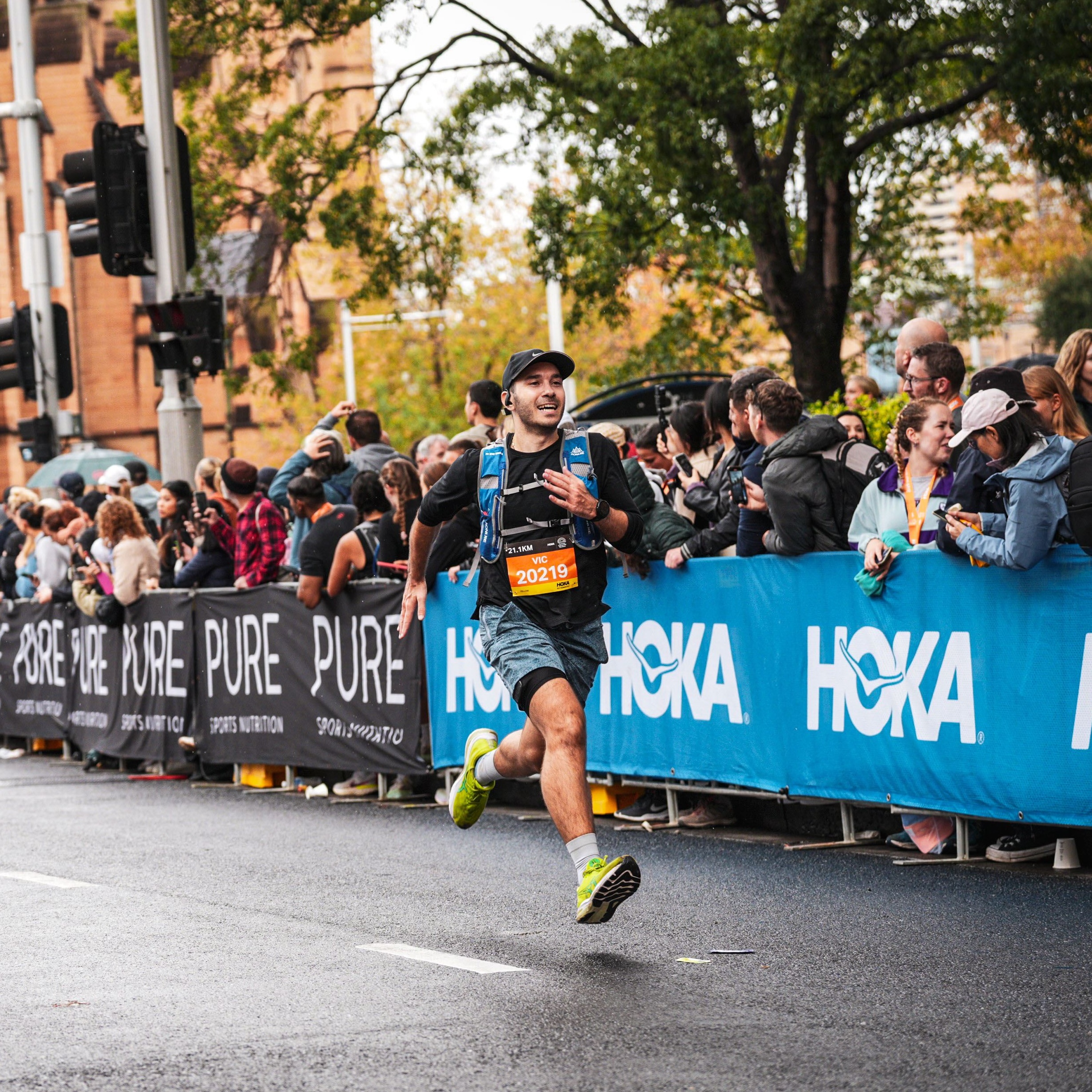 Victor sprinting to the finish line at his first ever half marathon.